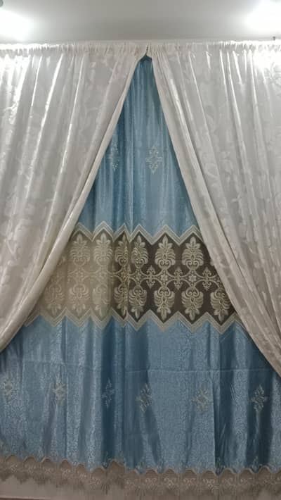 3pc pastel blue curtains 9ft.