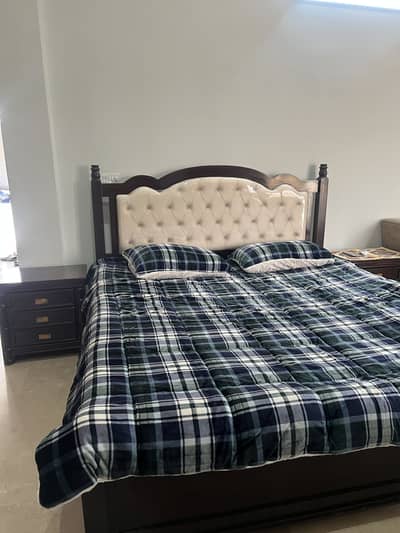 King size bed with side table and dressing table