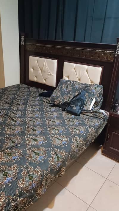 Double bed with mattress and side tables