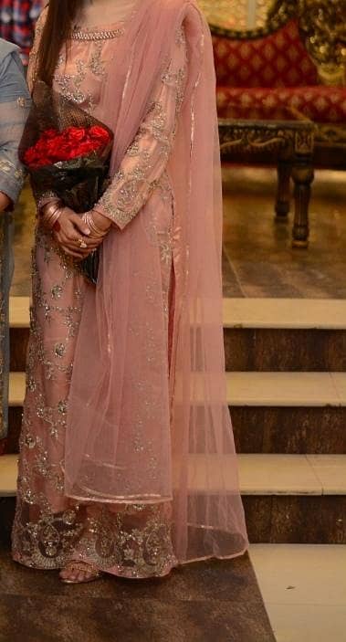 long net shirt along with capri trouser and net duppatta