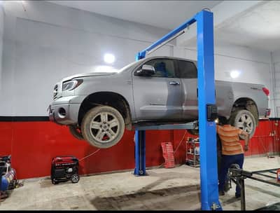 Car two post lift clear floor .