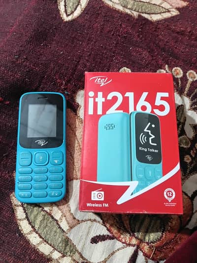 itel it2165. with box nd charger.
