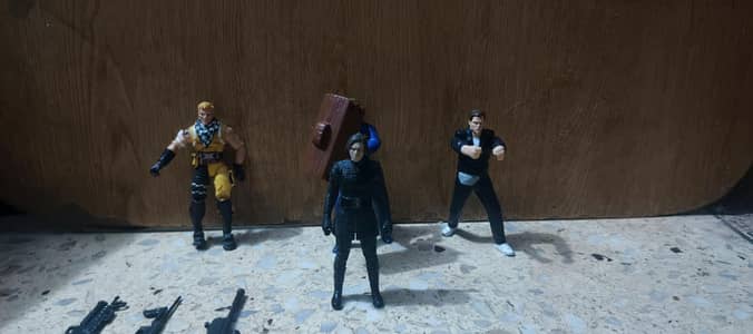 4 action figures with guns