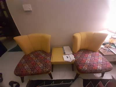 Two room chairs with table