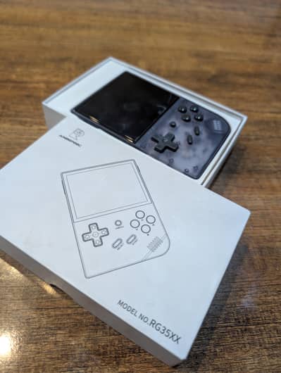 Anbernic RG35XX handheld game Console. Almost new with cable and card.