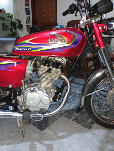 united 125 red color  registered on my name second owner