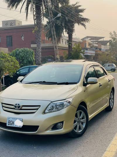 Corolla altas golden colour 2009 model