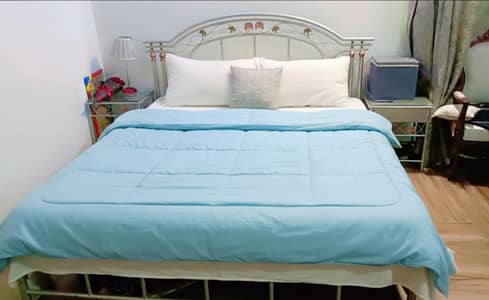 wrought iron bed | kingsized iron bed | iron bed | bed with side table