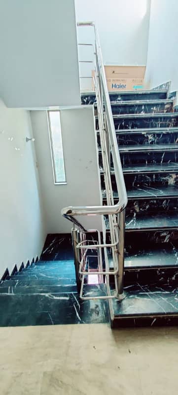 One Kanal house for sale with 8 bedrooms two car parking garage in GECHS phase 3 opposite Amanah Mall model town link road