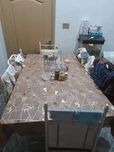 glass dining table with 6 chairs.