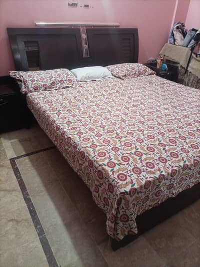 Bed with side tables and dresser