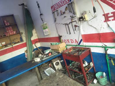 Bike lifter and air compressor and all over bike repairing tools