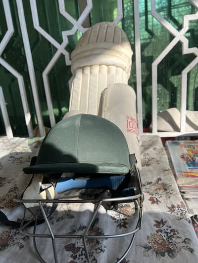 Cricket pads and helmet