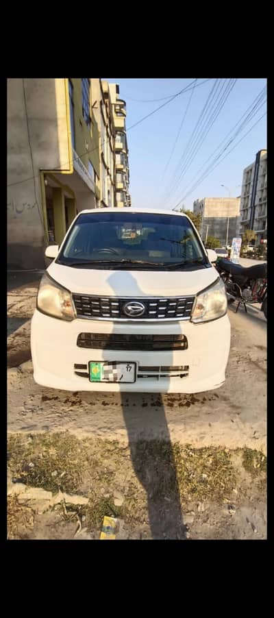 Daihatsu Move.     2015 model.     white colour.