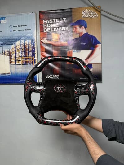 Multimedia steering red forge carbon fibre