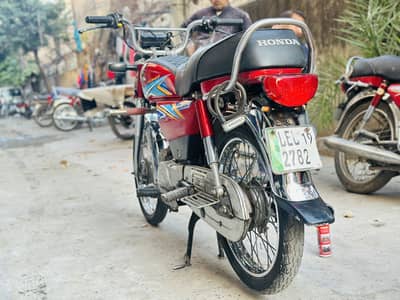 Honda CD 70 in red colour