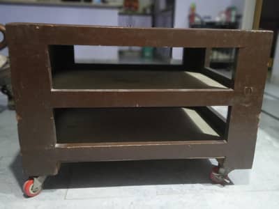 A pair of Wheel Trolly Table with glass top and 2 steps storage