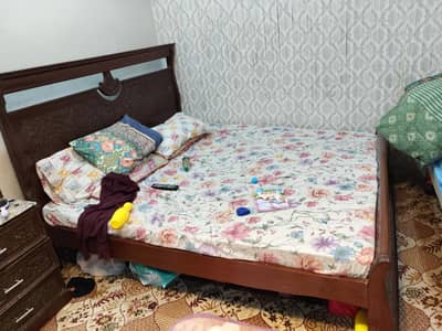 bed with side tables and dressing table