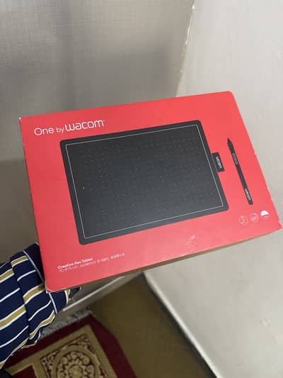 Brand new graphic tablet along with pen and cable .