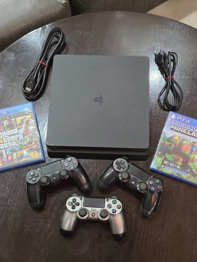 PS4 Slim 1Tb - Like New + 2 controllers & 2 games