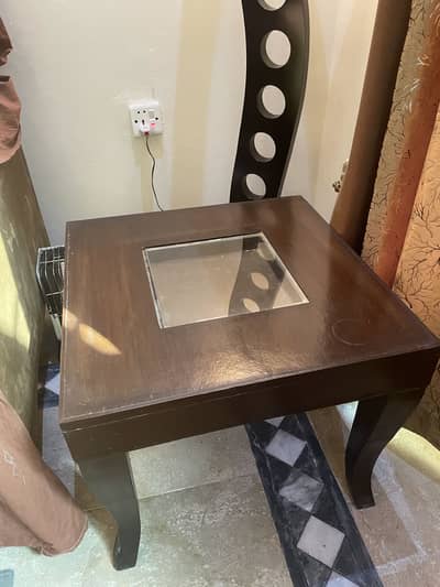 Solid wooden centre table with glass insert and matching side tables.