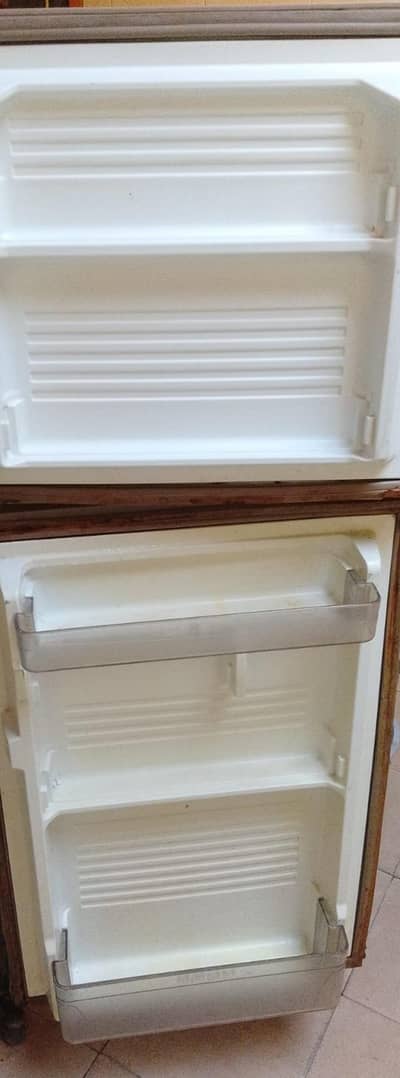 old model dowlance refrigerator. . . . .