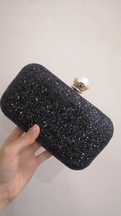 fancy black clutch for wedding or party wear.
