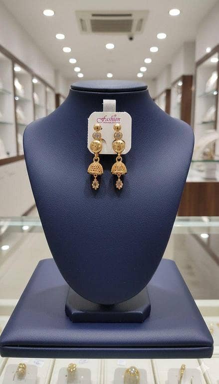Triple-Tier Gold Filigree Jhumka Earrings with Crystal Accents