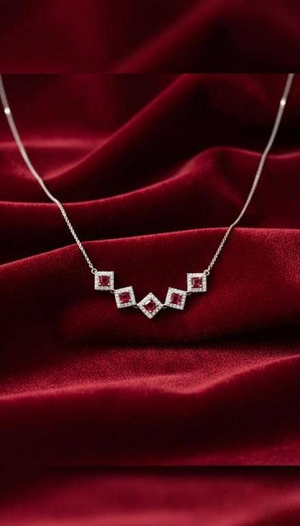 Silver V-Bracelet with Graduated Ruby-Red Halo Squares.