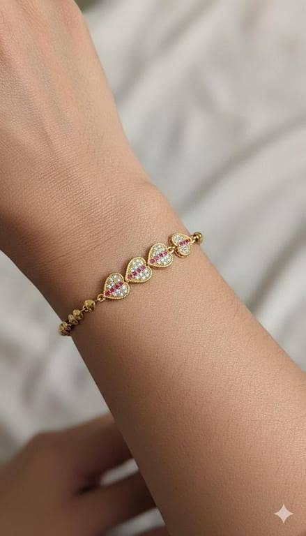 Gold Pavé Heart Bracelet with Ruby-Tone Accents. .