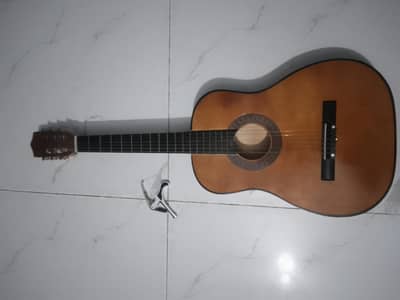 Slightly Used Guiter New condition , With Capo
