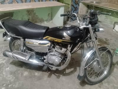 125 self start 23 model black gold