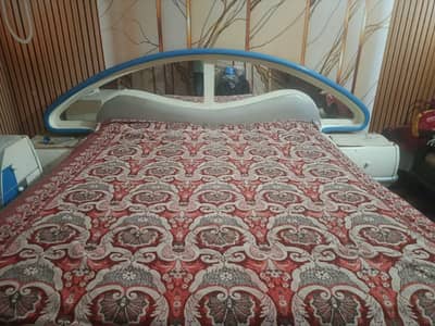 bed with side tables and dressing table