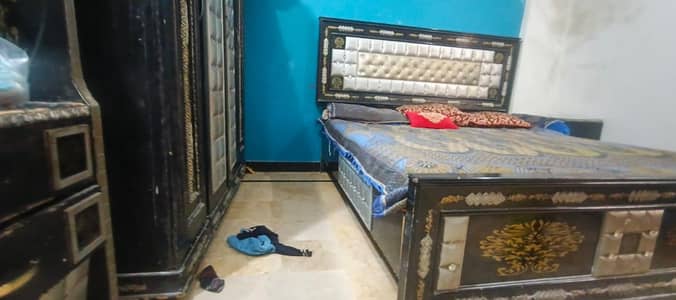 king size bed with dressing and side tables and almari