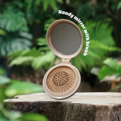 Hand mirror with Brush
