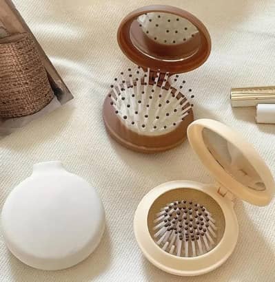 Hand mirror with Brush