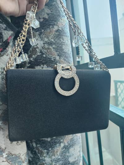 silver ND black clutch