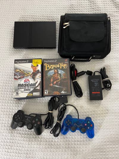 Sony PS2 with all accessories,. new games box pack