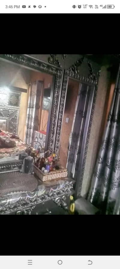 bed with side tables and dressing table