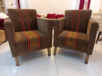 Brown Lounge Chairs and Pink Sofa