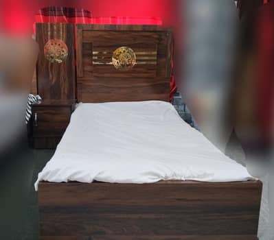 2 wooden single beds and one side table