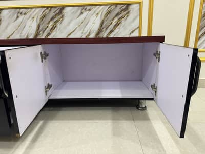 Black and red console for lounge