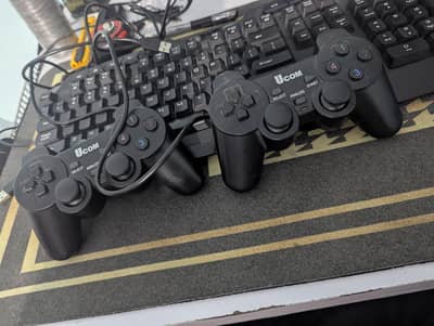 pair of ucom joystick controllers