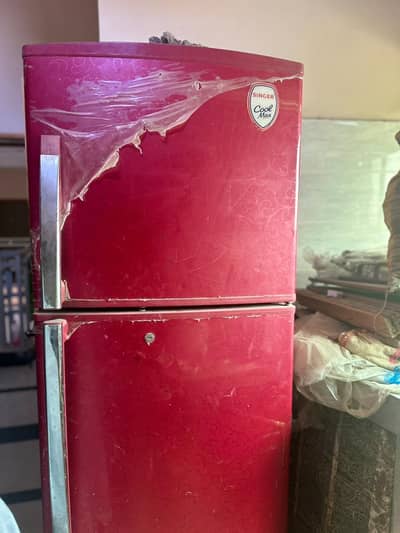 less used refrigerator in red color