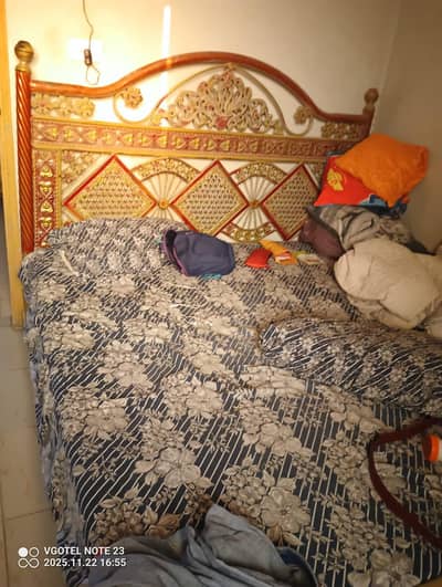 iron bed with mattress and dressing table