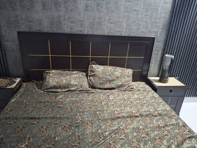 bed with dressing and side table