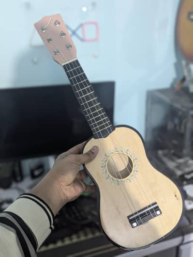 6 string small guitar converted into ukulele