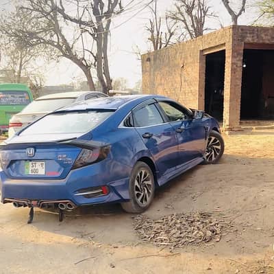 Honda civic vti orial prismatic full option ug total jeniun