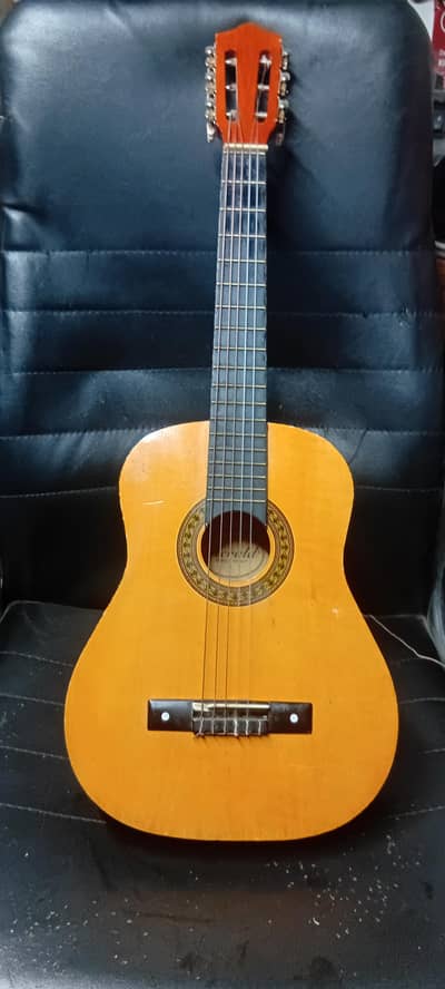 Guitar mini size good condition wooden color also wooden