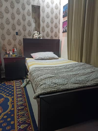 single bed and side table